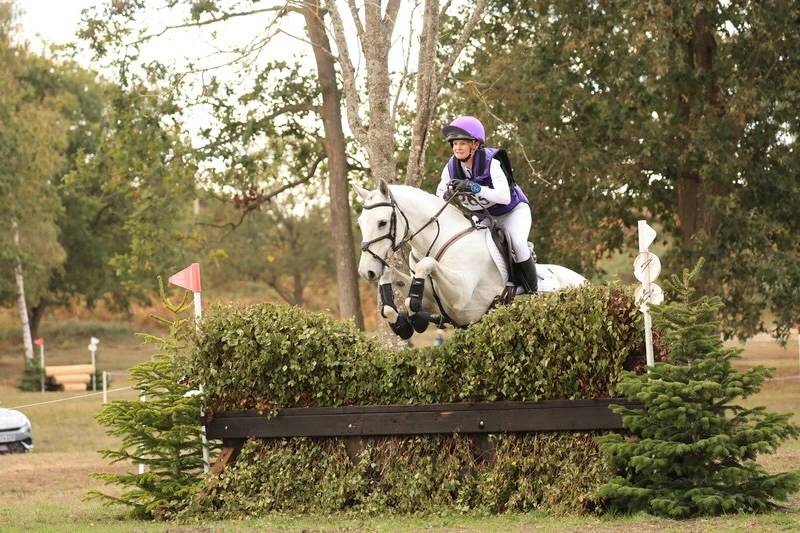Jo Mair and Tully jumping a cross-country fence at Tweseldown